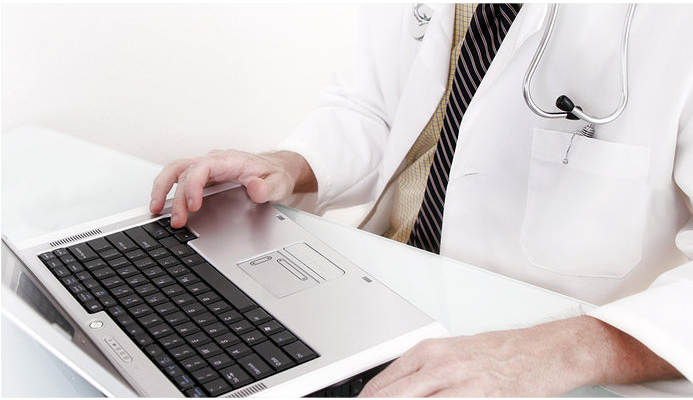 Medical billing consultant reviewing healthcare revenue cycle data on a laptop